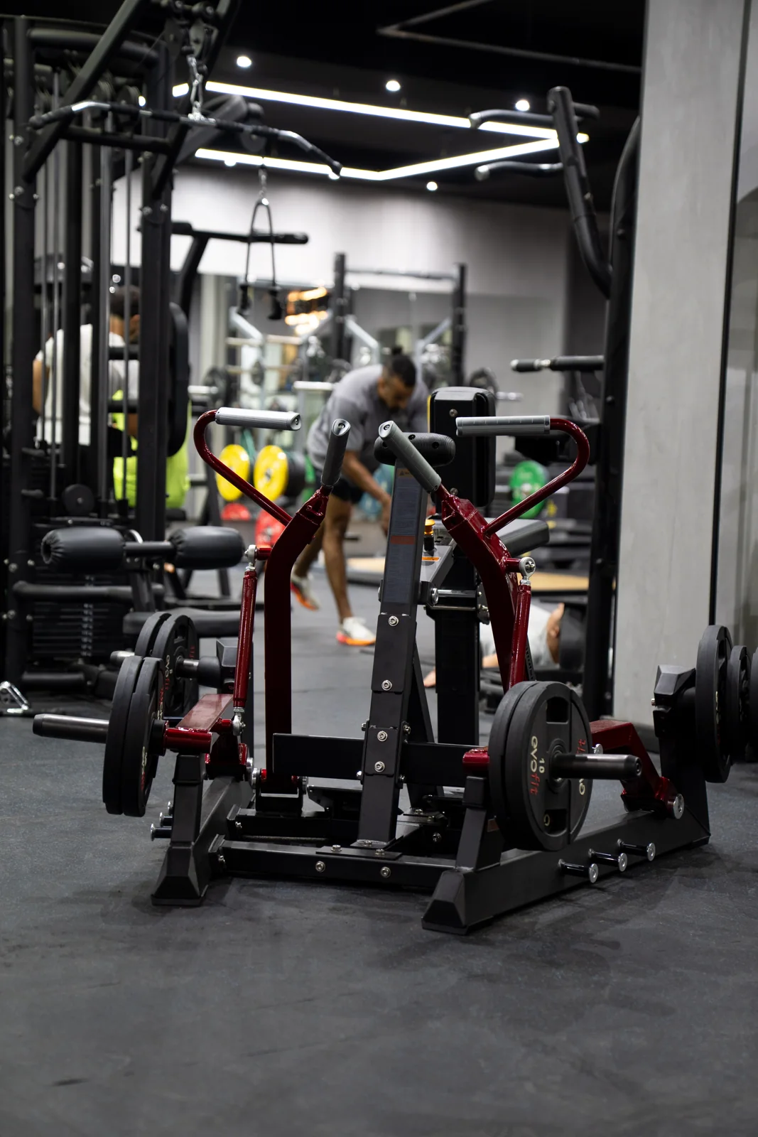Red strength training equipment at Gymaholic Plus